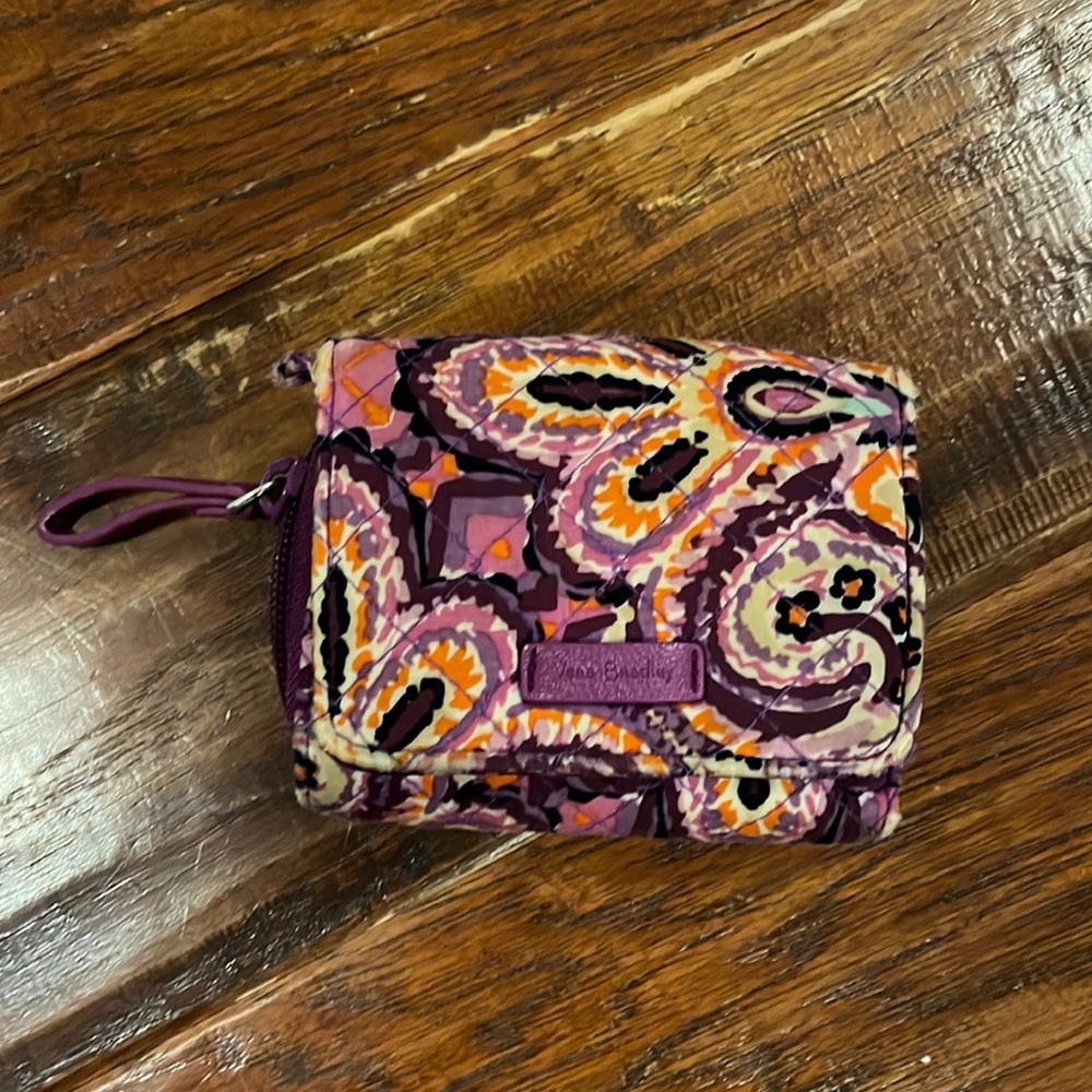 Vera Bradley Zip Around Wallet. Snap Closure and Zippered Pockets.